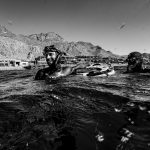 An athlete and his safety at the surface of Blue Hole, Dahab, after a new personal best.