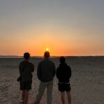 Three peoples at Ras Mohammed national park, looking an beautiful colorful sunset, Egypt.